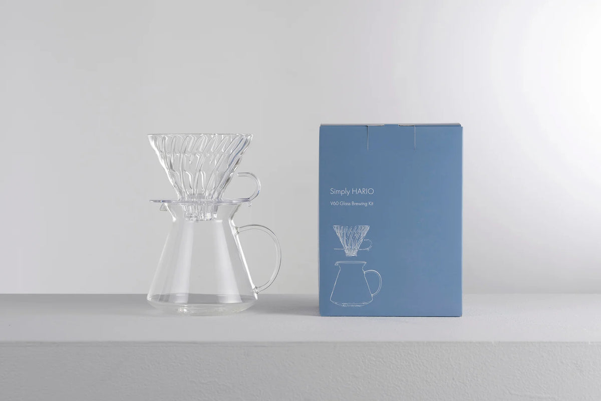Hario V60 glass brewing kit on a coffee scale at a coffee station