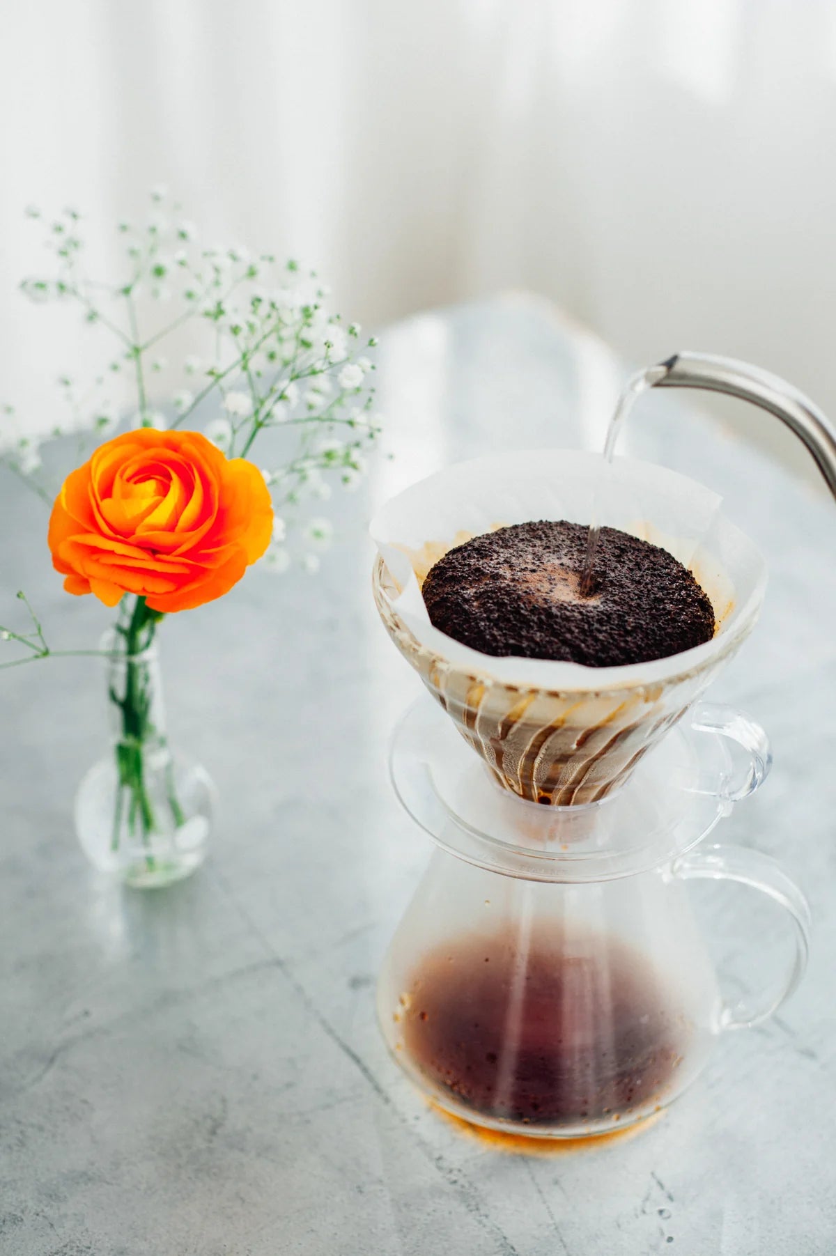 Simply Hario V60 Glass Brewing Kit with glass dripper, server, paper filters, and scoop